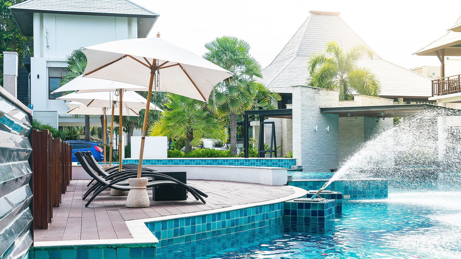 beautiful luxury hotel swimming pool resort with umbrella chair 1